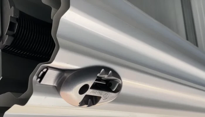 Technician repairing a commercial overhead door